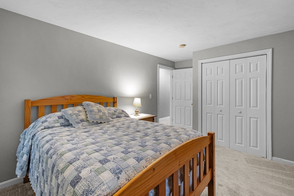 4 Penny Lane Wareham, MA 02558 - Photo 22 of 32 a bedroom with a bed and a dresser