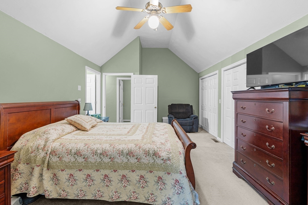 4 Penny Lane Wareham, MA 02558 - Photo 24 of 32 a bedroom with a bed and a flat tv screen on dresser