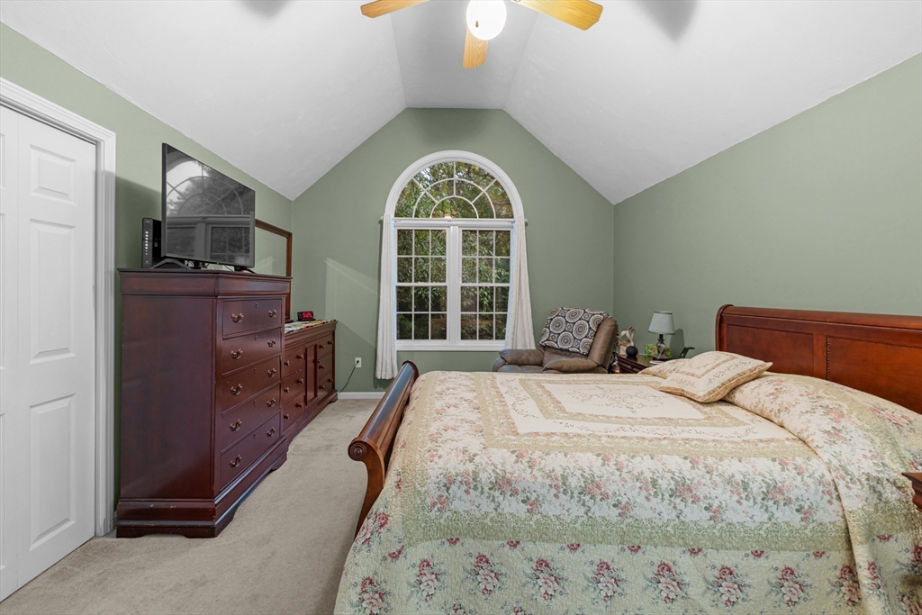 4 Penny Lane Wareham, MA 02558 - Photo 26 of 32 a spacious bedroom with a bed and window