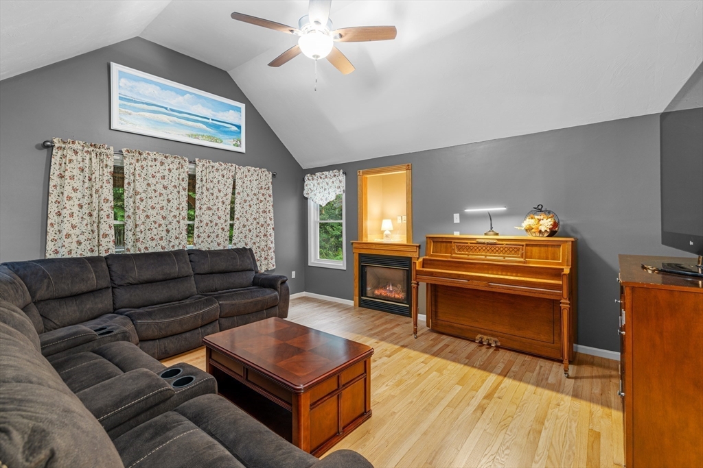 4 Penny Lane Wareham, MA 02558 - Photo 6 of 32 a living room with furniture a piano and a flat screen tv