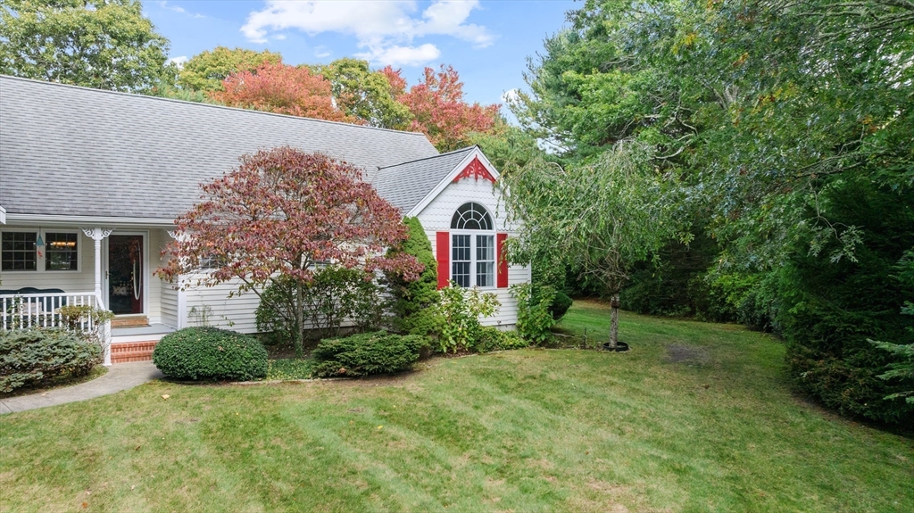4 Penny Lane Wareham, MA 02558 - Photo 9 of 32 a view of a house with a small yard and large tree
