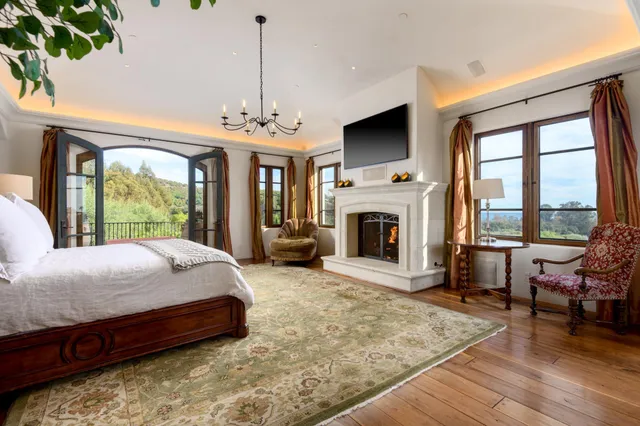 a bed room with a bed and a fireplace