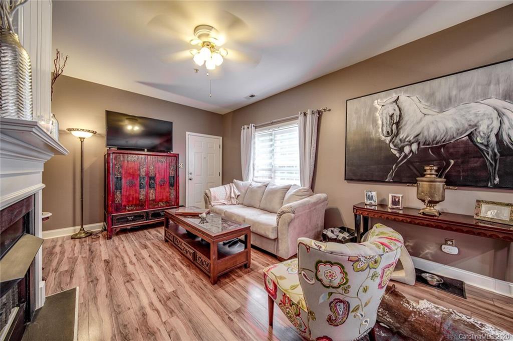 917 Shearer Street, Unit 7 Davidson, NC 28036 - Photo 11 of 31 a living room with furniture and a flat screen tv