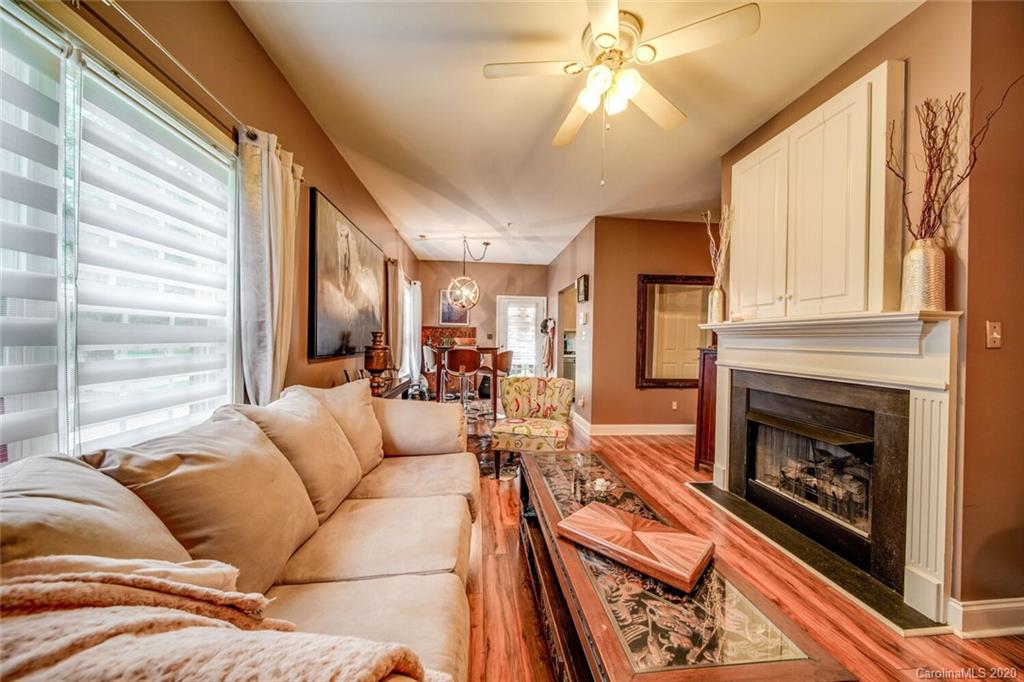 917 Shearer Street, Unit 7 Davidson, NC 28036 - Photo 15 of 31 a living room with furniture fireplace and flat screen tv