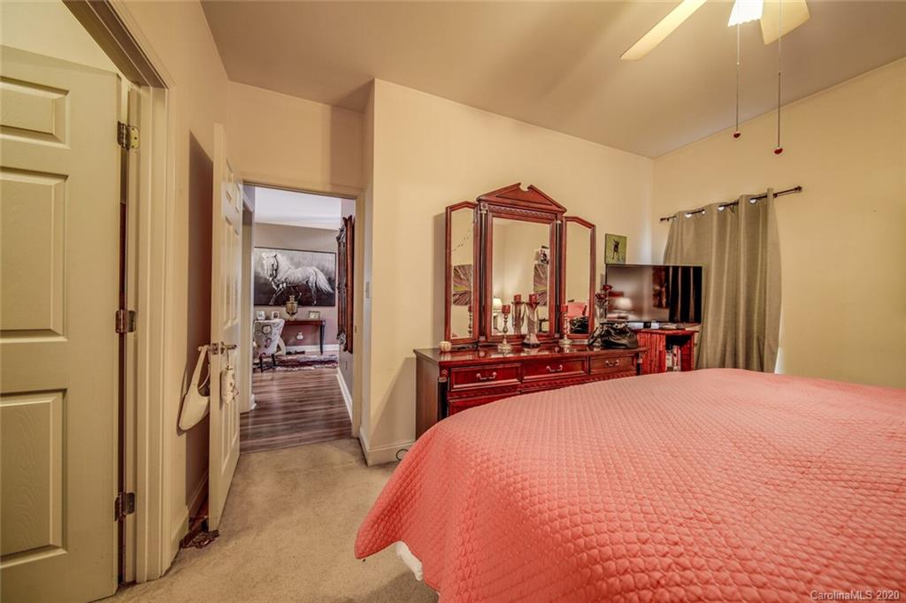 917 Shearer Street, Unit 7 Davidson, NC 28036 - Photo 18 of 31 a view of a bedroom with sink and mirror