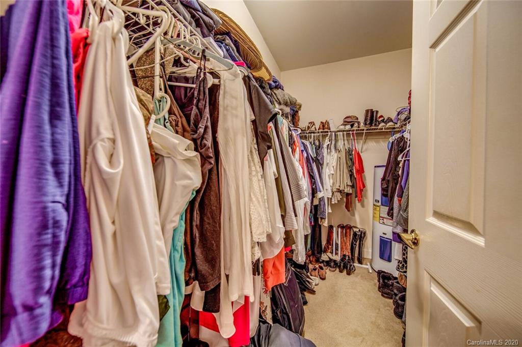 917 Shearer Street, Unit 7 Davidson, NC 28036 - Photo 19 of 31 a view of walk in closet with clothes
