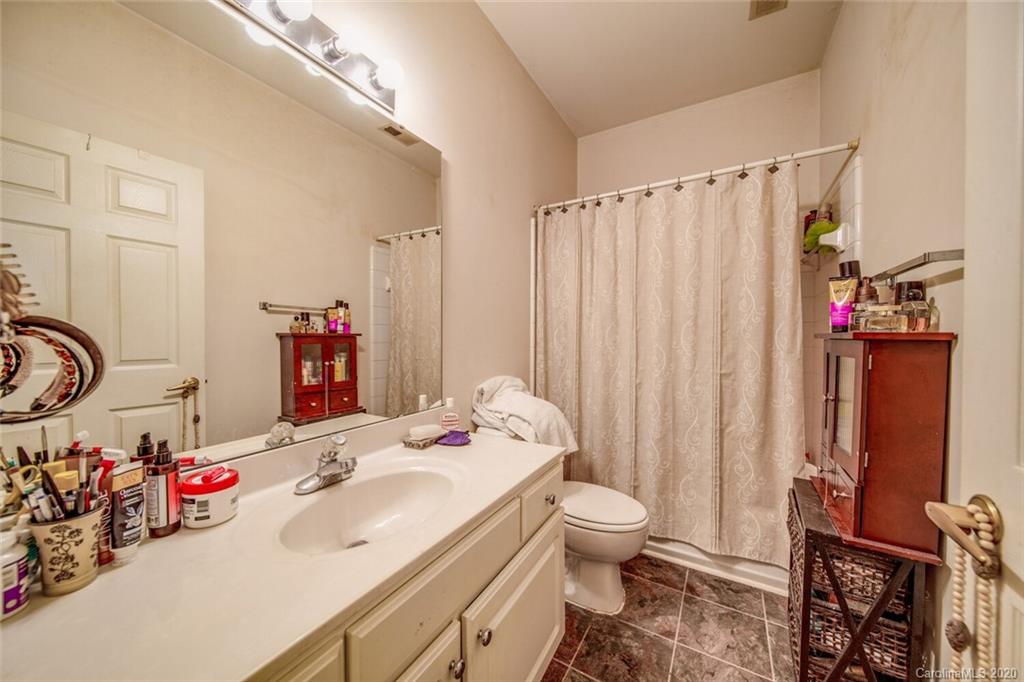 917 Shearer Street, Unit 7 Davidson, NC 28036 - Photo 20 of 31 a bathroom with a sink toilet and shower