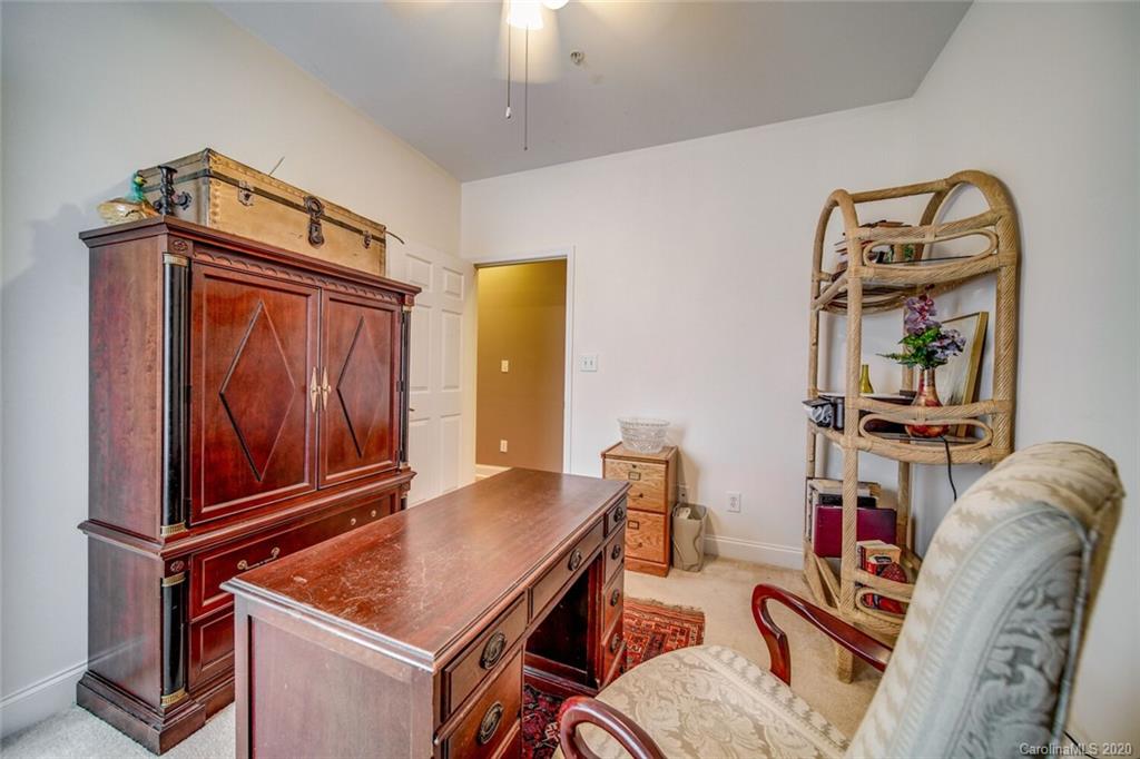 917 Shearer Street, Unit 7 Davidson, NC 28036 - Photo 25 of 31 a room with furniture and wooden floor