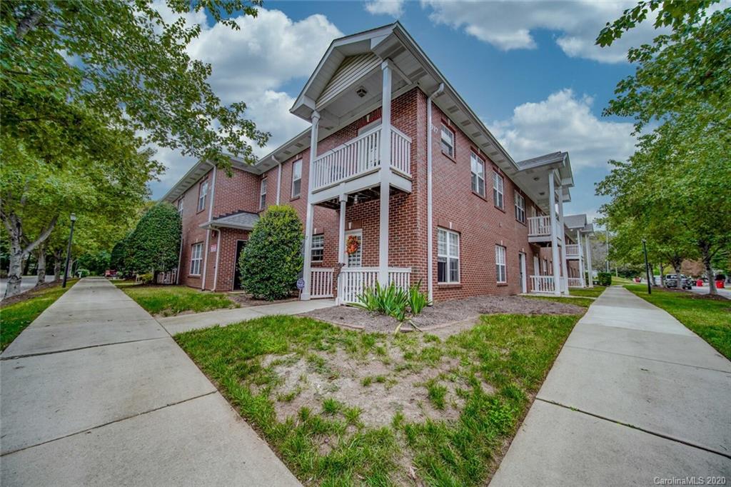 917 Shearer Street, Unit 7 Davidson, NC 28036 - Photo 30 of 31 a front view of a house with a yard and trees