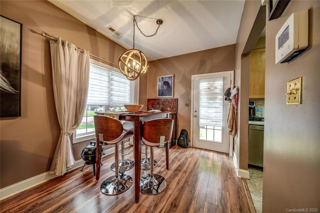 917 Shearer Street, Unit 7 Davidson, NC 28036 - Photo 4 of 31 a view of a dining room with furniture window and wooden floor