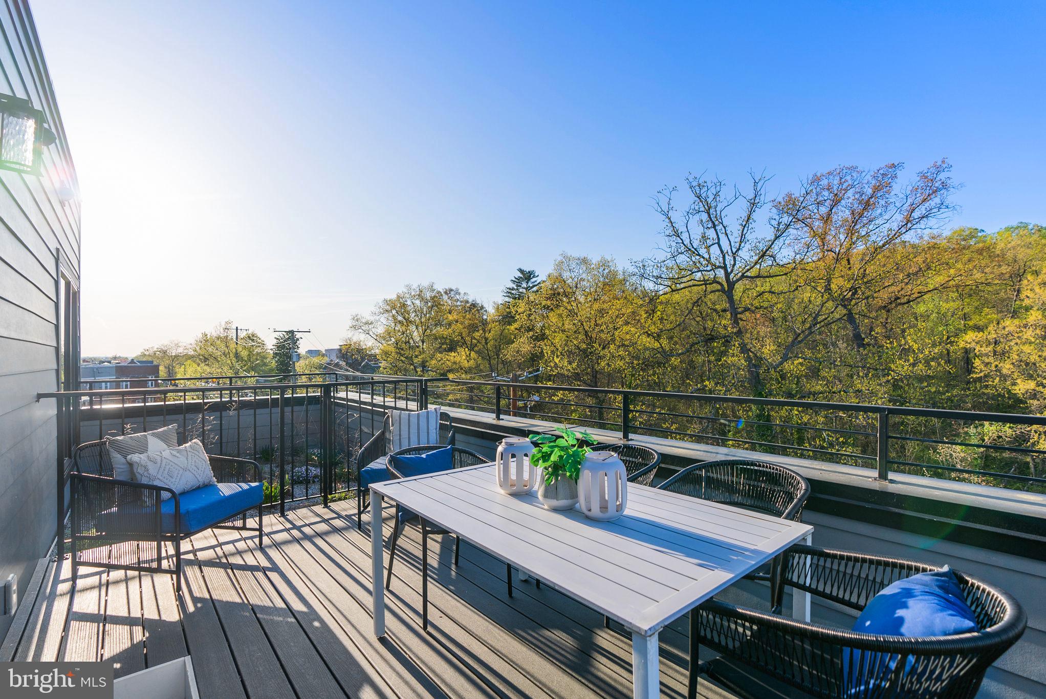 2019 M Street Northeast, Unit PH9 Washington, DC 20002 - Photo 18 of 34 a view of a balcony with two chairs and a potted plant