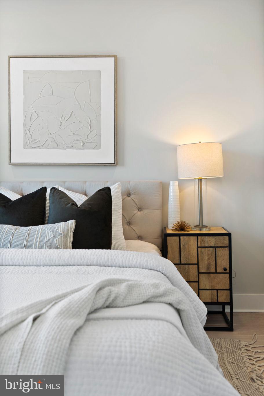 2019 M Street Northeast, Unit PH9 Washington, DC 20002 - Photo 20 of 34 a bedroom with a bed and a lamp