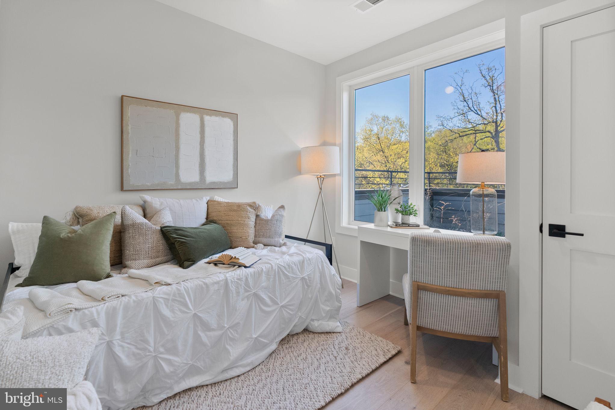 2019 M Street Northeast, Unit PH9 Washington, DC 20002 - Photo 26 of 34 a bedroom with a bed and a window