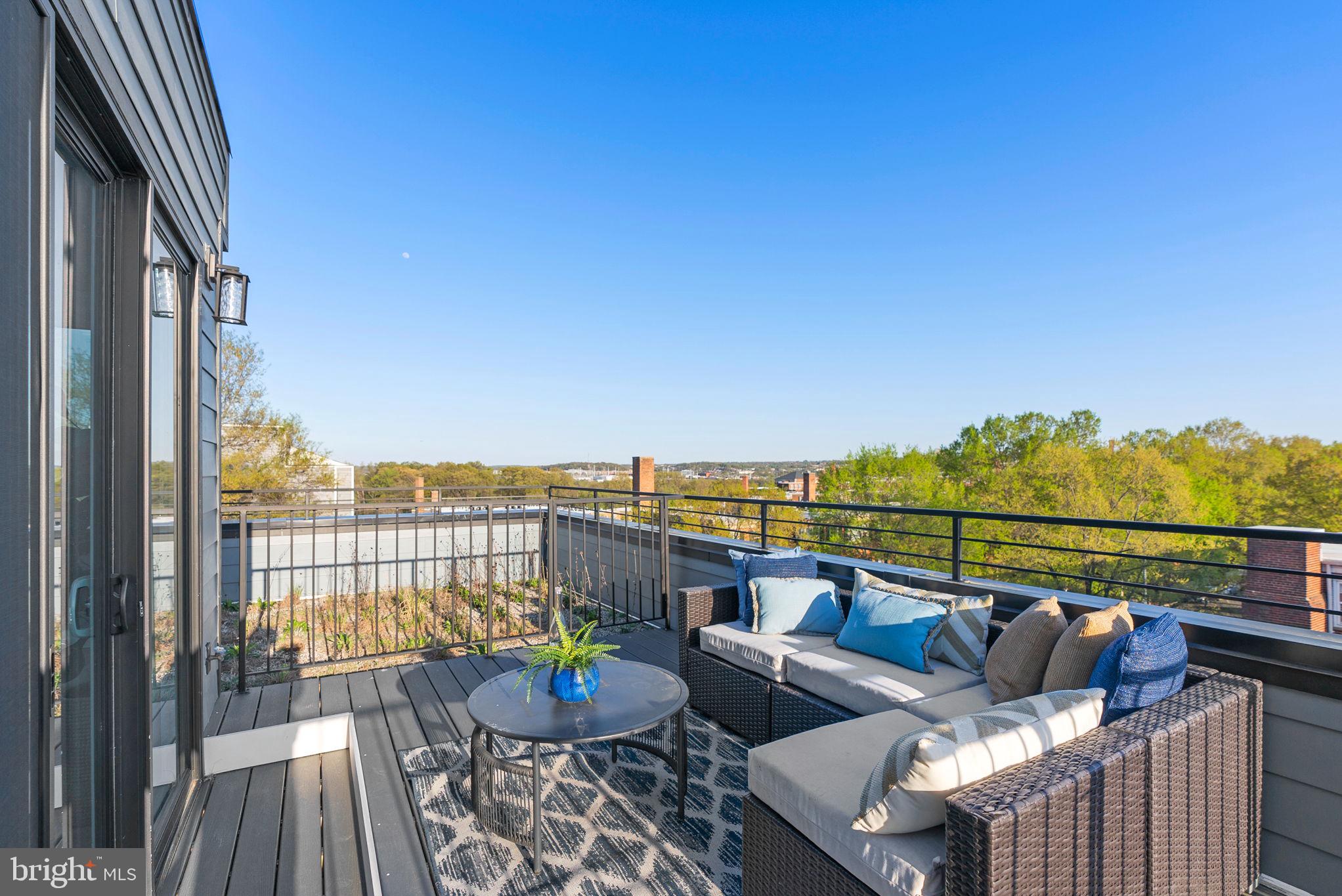 2019 M Street Northeast, Unit PH9 Washington, DC 20002 - Photo 7 of 34 a view of a roof deck with couches and potted plants