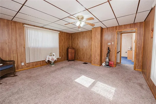 a view of empty room with ceiling fan