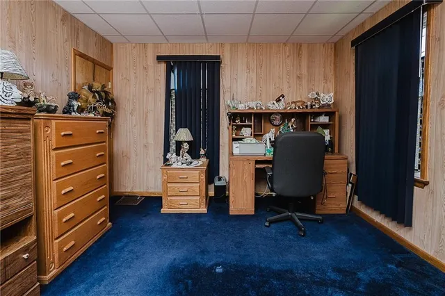 a view of workspace with wooden floor and windows