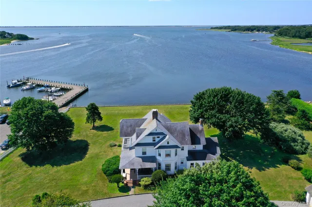an aerial view of a house with garden space and outdoor seating
