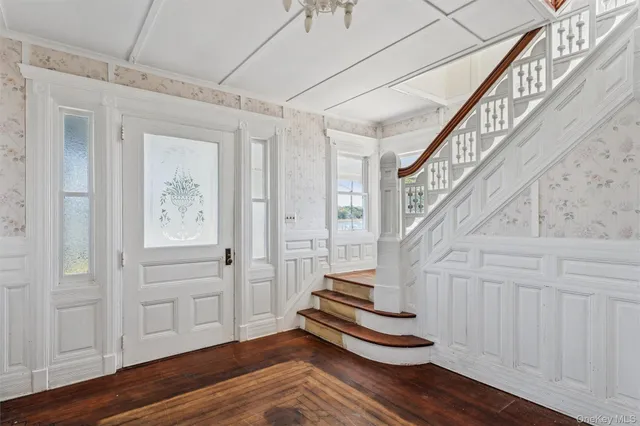 a view of entryway with wooden floor