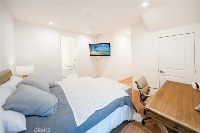 a bathroom with a tub a toilet and a shower