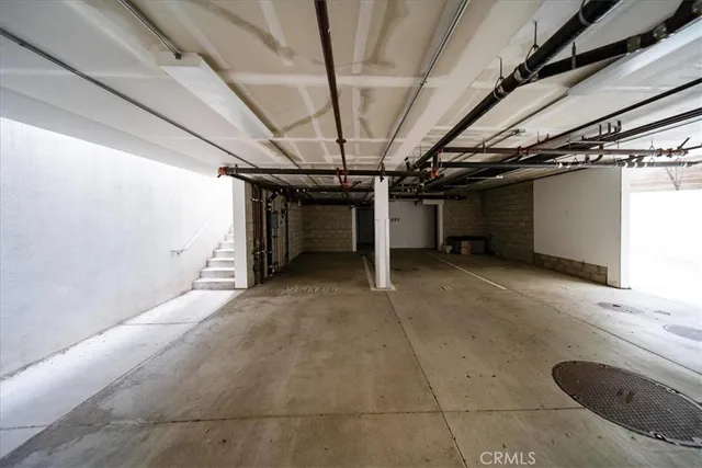 a view of a patio with table and chairs potted plants and large tree