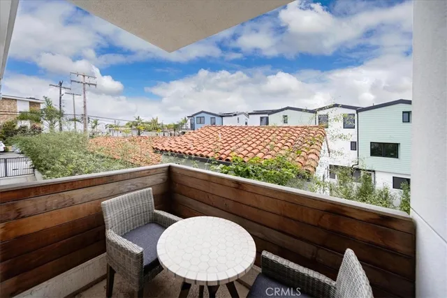 a living room with fireplace furniture and a wooden floor