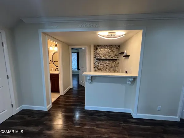 a view of entryway with wooden floor