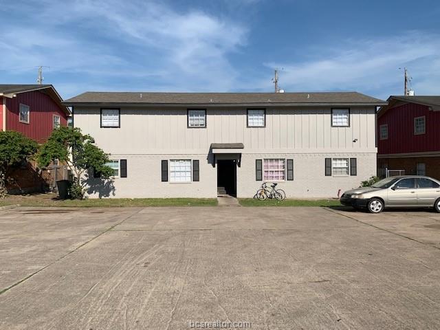 a view of a car parked in front of a building
