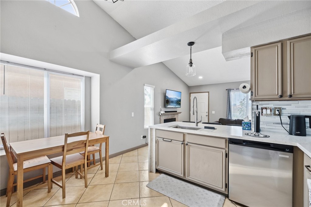 129 Avocado Avenue Perris, CA 92571 - Photo 12 of 30 a kitchen with a sink stove and cabinets