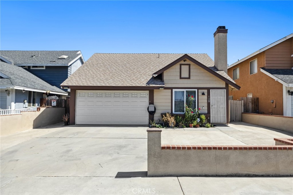 129 Avocado Avenue Perris, CA 92571 - Photo 2 of 30 a front view of a house with a yard