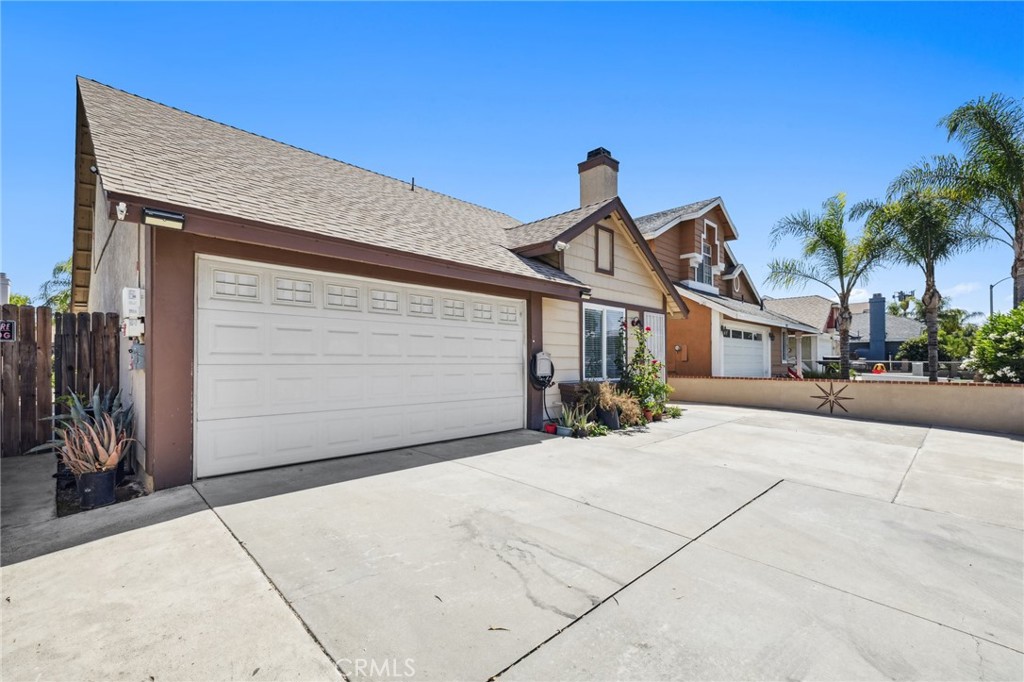 129 Avocado Avenue Perris, CA 92571 - Photo 3 of 30 a view of a house with a patio