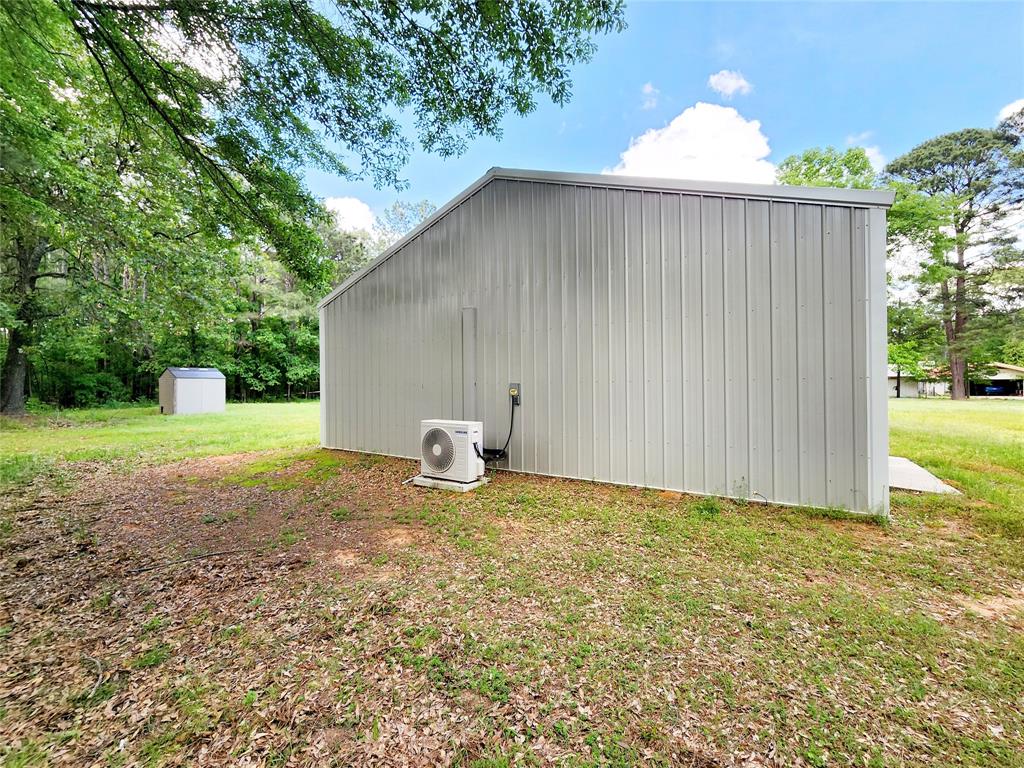 3514 Buchanan Loop Road Texarkana, TX 75501 - Photo 38 of 40 a backyard of a house with plants and garden