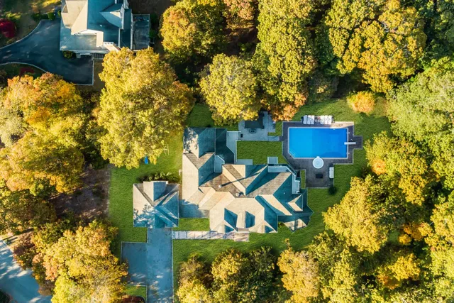 a view of yard from deck having outdoor seating