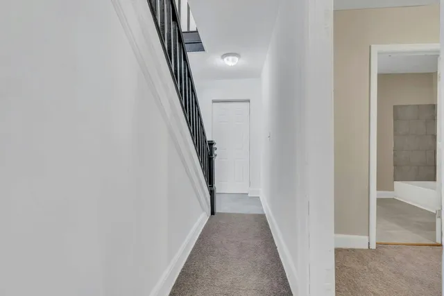a view of a hallway with windows