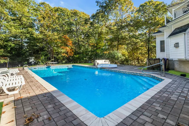 a view of a swimming pool with a patio