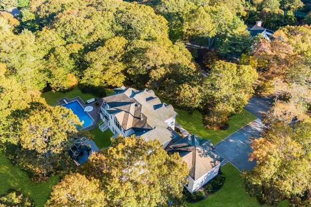 an aerial view of residential houses with outdoor space