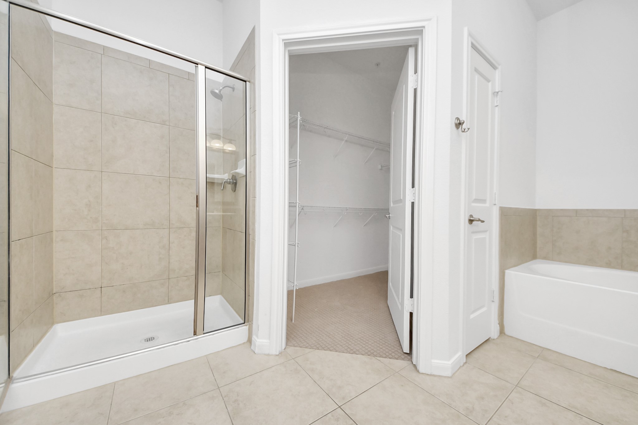 6363 San Felipe Street, Unit 465 Houston, TX 77057 - Photo 21 of 49 a bathroom with a bathtub and a shower