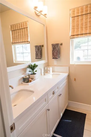 a bathroom with a sink and a window