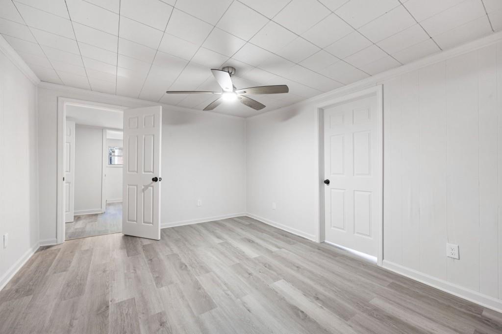 24 East Iron Belt Road Southeast Cartersville, GA 30120 - Photo 22 of 39 wooden floor in an empty room with a ceiling fan