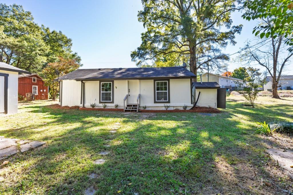 24 East Iron Belt Road Southeast Cartersville, GA 30120 - Photo 31 of 39 a view of a house with backyard and a tree