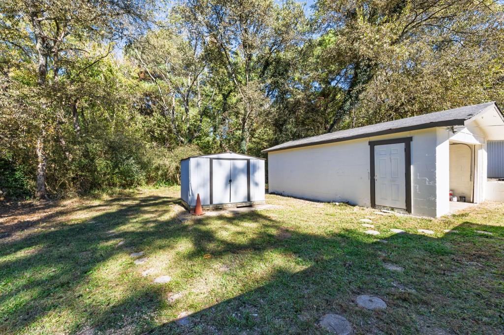 24 East Iron Belt Road Southeast Cartersville, GA 30120 - Photo 32 of 39 a backyard of a house with yard and outdoor seating