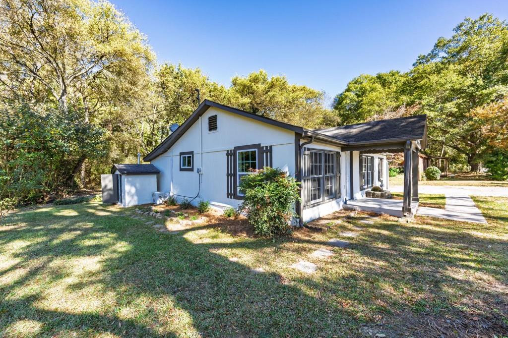 24 East Iron Belt Road Southeast Cartersville, GA 30120 - Photo 37 of 39 a view of a house with a yard and potted plants