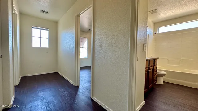 a view of a bathroom with a tub and shower