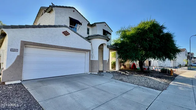 a front view of a house with a garage