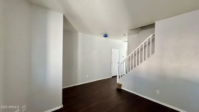 a view of entryway with wooden floor