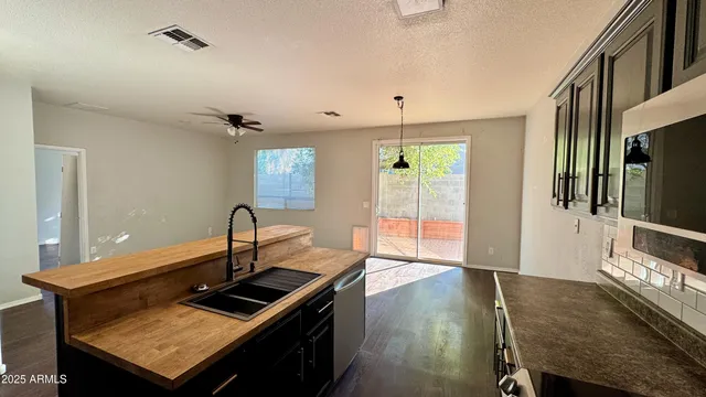 a kitchen with stainless steel appliances granite countertop a stove and a refrigerator