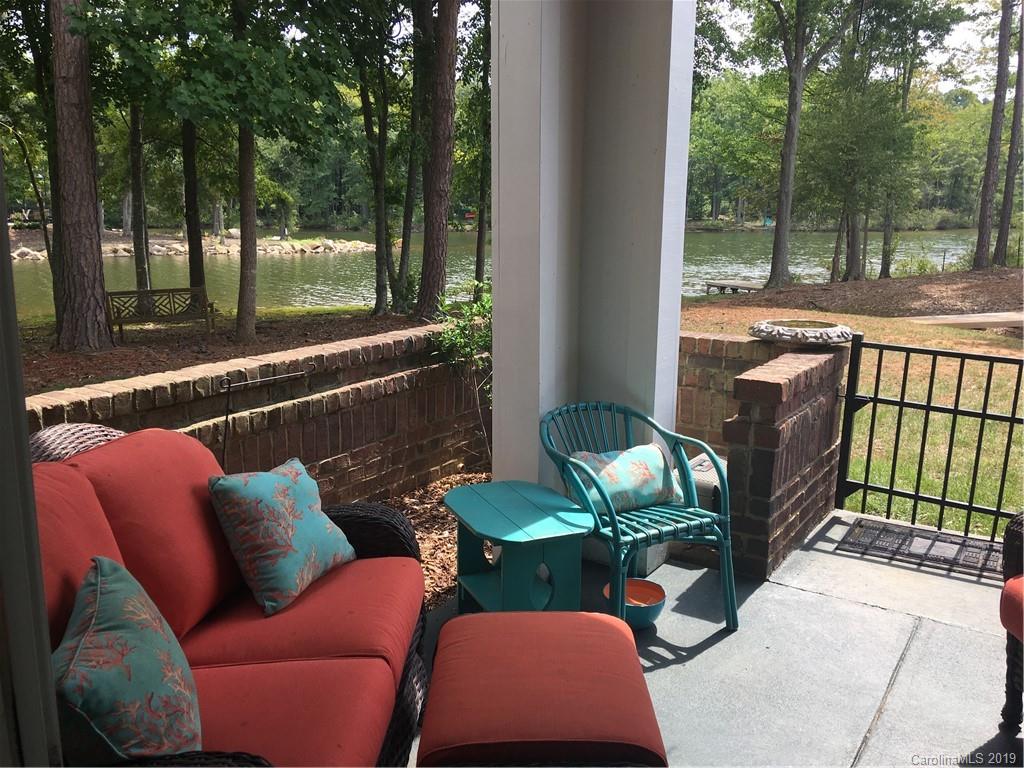 779 Peninsula Drive Davidson, NC 28036 - Photo 2 of 31 a balcony with couple of chairs and a couch