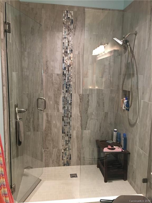 779 Peninsula Drive Davidson, NC 28036 - Photo 24 of 31 a bathroom with a bathtub and shower