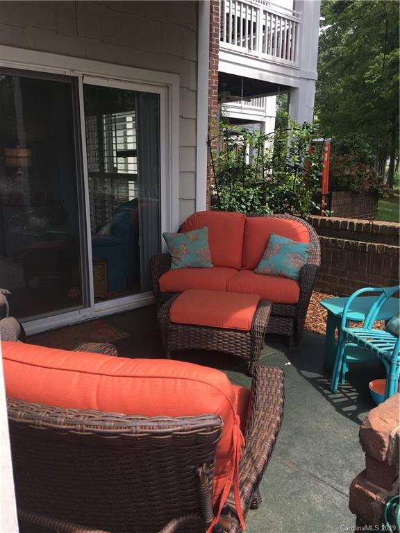 779 Peninsula Drive Davidson, NC 28036 - Photo 27 of 31 a outdoor living space with furniture and a floor to ceiling window