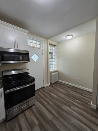a kitchen with a stove and a microwave