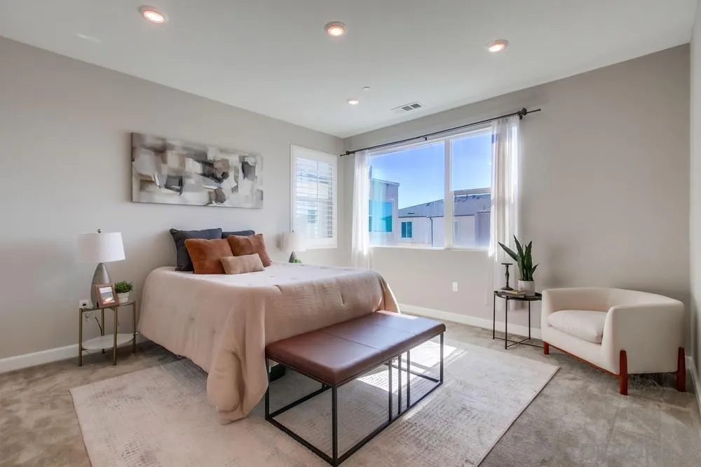 1956 Infinity Lane Chula Vista, CA 91915 - Photo 12 of 58 a spacious bedroom with a bed and a couch